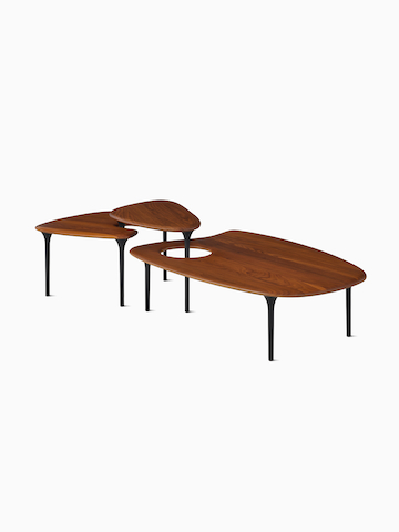Cyclade Tables family, walnut. Select to go to the Cyclade Tables product page.