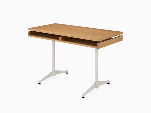 An Eames 2500 Series Executive Desk in oak with white legs.