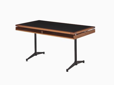 An Eames 2500 Series Executive Desk in walnut with black leather inlay.