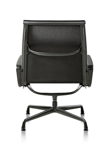 Rear view of an Eames Aluminum Group outdoor chair in a black weave fabric, showing the aluminum frame structure.  