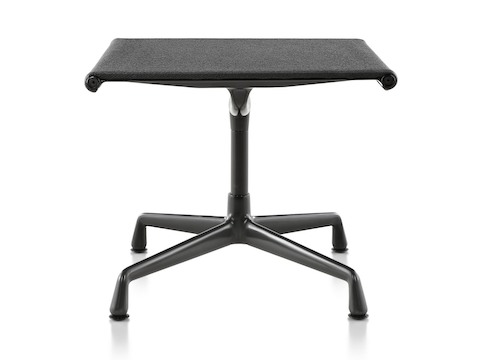 An Eames Aluminum Group outdoor ottoman in a black weave fabric. An Eames Aluminum Group outdoor ottoman in a black weave fabric.