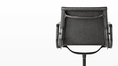 Rear view of a black Eames Aluminum Group outdoor chair, focusing on the proprietary Outdoor Weave fabric. 