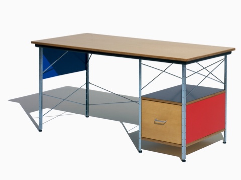 An Eames Desk in a bright color scheme with birch, red, black, and blue accents, viewed from a 45-degree angle.