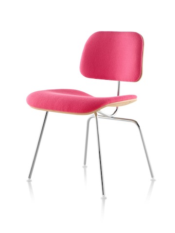 Eames Molded Plywood Chair with red upholstery and chrome-plated legs, viewed from a 45-degree angle. Eames Molded Plywood Chair with red upholstery and chrome-plated legs, viewed from a 45-degree angle.