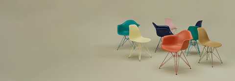 Eames Molded Plastic Chair group shot on sage background. Eames Molded Plastic Chair group shot on sage background.