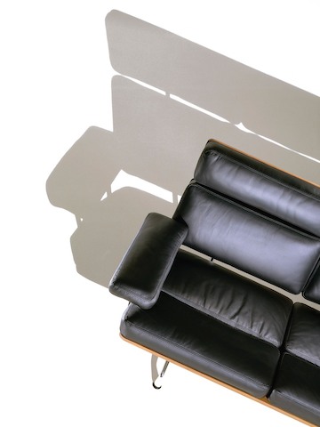 Overhead view of a partial black leather Eames Sofa. Overhead view of a partial black leather Eames Sofa.