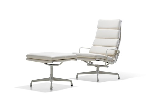 White leather Eames Soft Pad lounge chair and ottoman. 