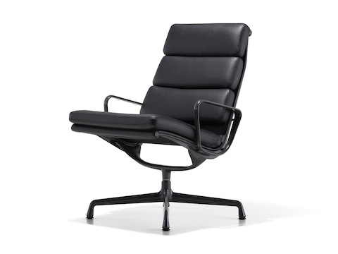 Black leather Eames Soft Pad lounge chair, viewed from a 45-degree angle.