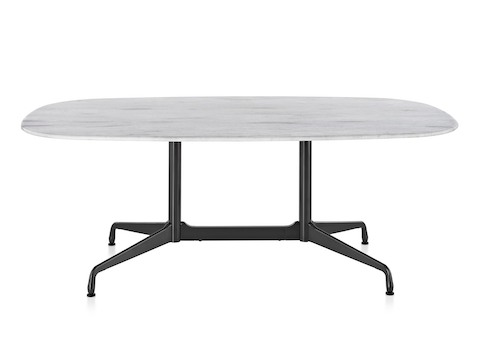 An oval Eames outdoor table with a white marble top and black base.