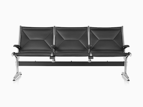 Three connected black sling seating with integrated power source that includes USB-C port, USB-A port, and A/C power outlet. Three connected black sling seating with integrated power source that includes USB-C port, USB-A port, and A/C power outlet.