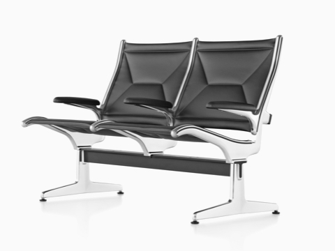 Angled view of black leather Eames Tandem Sling Seating with two seating positions. 