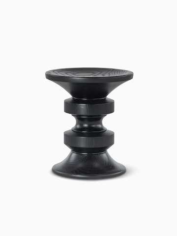 A D-shaped Eames Turned Stool in ebonised ash.