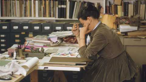 Ray at work with Eames Stool models in May 1960.