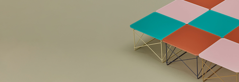 Grid of various colors of Eames Wire Base Low Tables.
