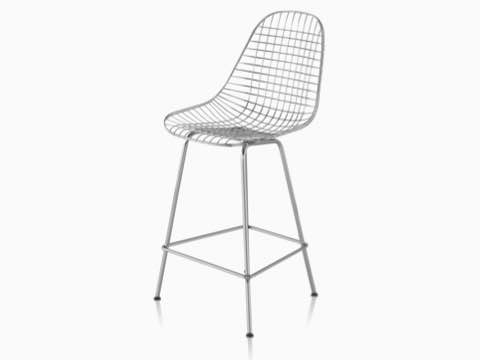 Upper half of a silver Eames Wire Stool., viewed from a 45-degree angle. Upper half of a silver Eames Wire Stool., viewed from a 45-degree angle.