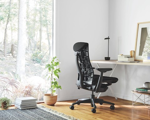Black Embody office chair at a Nelson X-Leg Table.