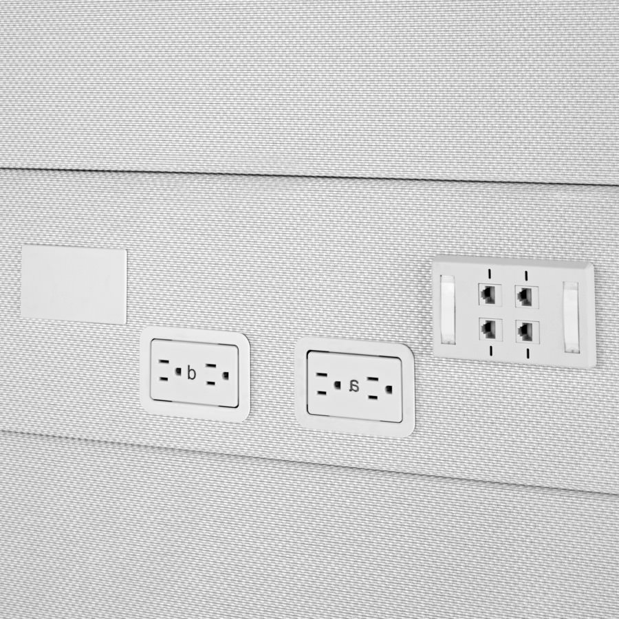 Detail of power and data receptacles on Ethospace tiles in a light gray textile.