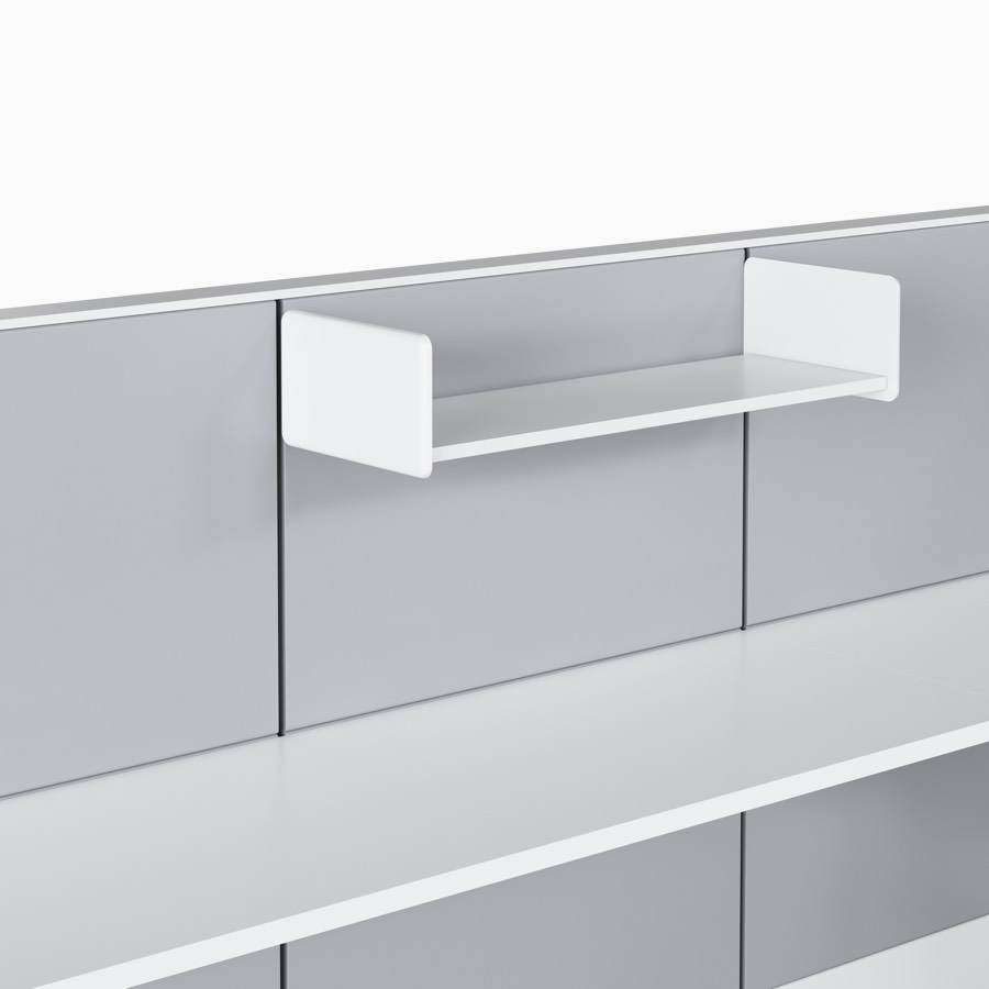 Ethospace wall unit with tiles in a light gray finish and a white work surface, with a white open shelf hung above.