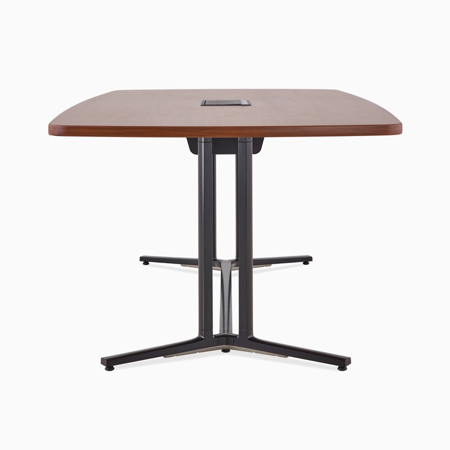 Side view of a square edge rectangular Everywhere conference table with a medium walnut woodgrain laminate top, central power access, and a black base.