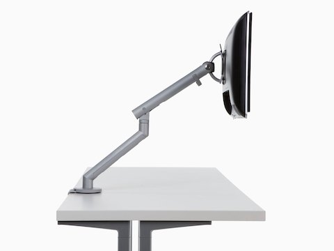 Profile view of a monitor attached to a fully extended Flo Monitor Arm.
