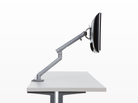 Profile view of a monitor attached to a fully extended Flo Monitor Arm.