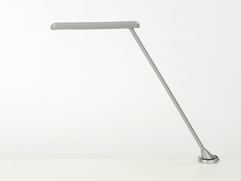 Profile view of a silver clamp-mounted Flute Personal Light. Profile view of a silver clamp-mounted Flute Personal Light.