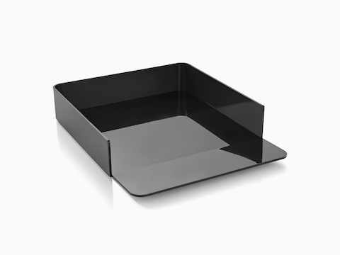 Angled view of a black Formwork Paper Tray with a gently sloped lip.