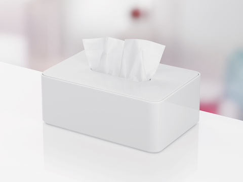Eine weiße Formwork Tissue Box mit hervorstehendem Gewebe.