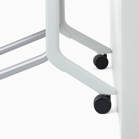 A detail highlighting the wall-saver legs of a Fuld Nesting Chair.