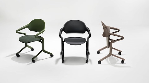 A lineup of three Fuld Nesting Chairs, one in Olive with the 3D Knit textile, one in Black, and one in Cocoa with the 3D Knit textile.