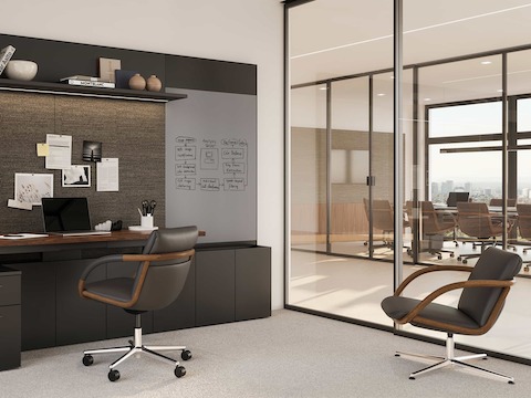 Full Loop office chair with a Geiger One Private Office set up and a Full Loop Lounge Chair in the corner.