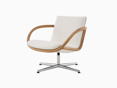 Angled view of Full Loop Lounge Chair in Oak and Capri. Angled view of Full Loop Lounge Chair in Oak and Capri.