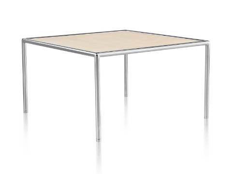 A square Full Round Table with a tan top and tubular metal frame. A square Full Round Table with a tan top and tubular metal frame.