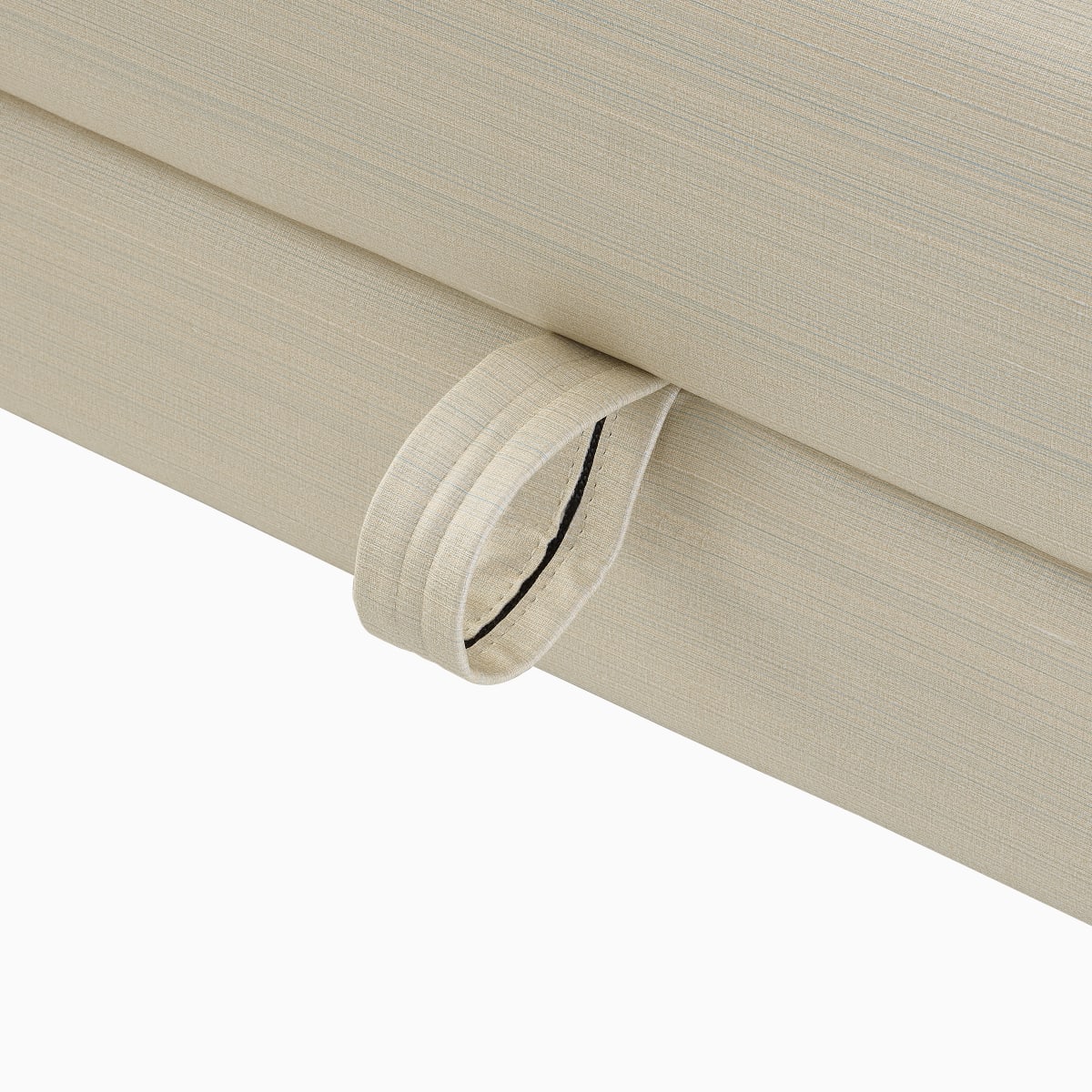 A close-up view of a pull tab on the Gemma Sleep Settee. 