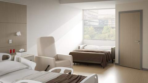 Gemma Sleep Settee shown with Gemma Recliner in a patient room, in sleeping position.