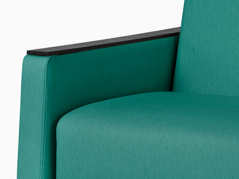 Detail view of a Gemma Sleep Settee in a teal textile. 