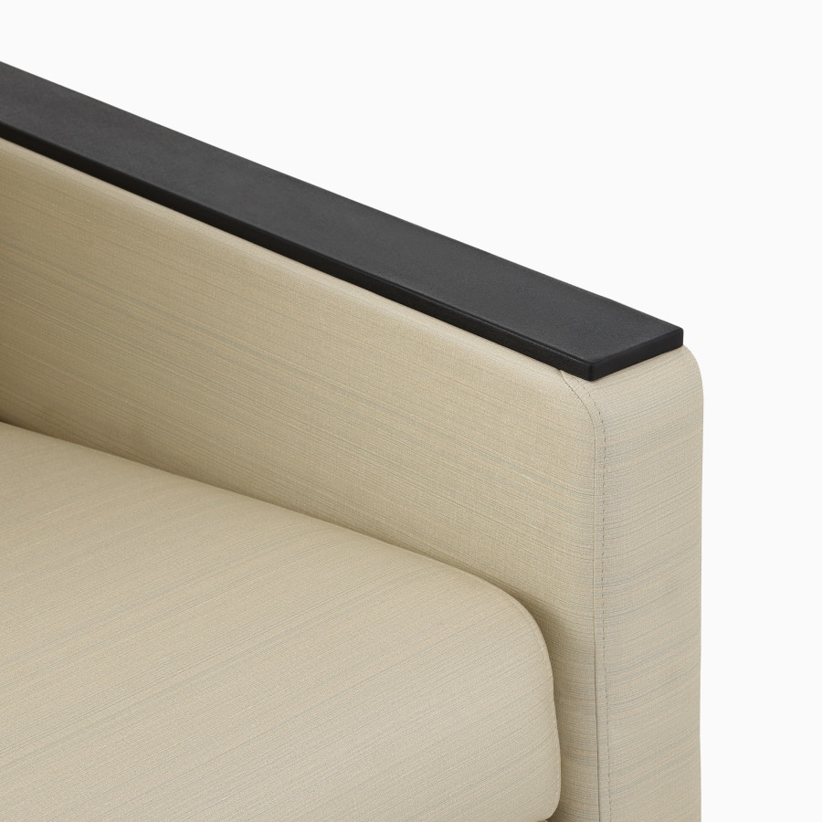 Detailed view of black flat armrest. 