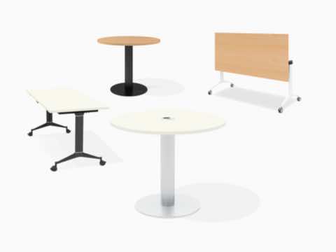 A group of two Genus conference tables, one with a Y leg and one with column base.