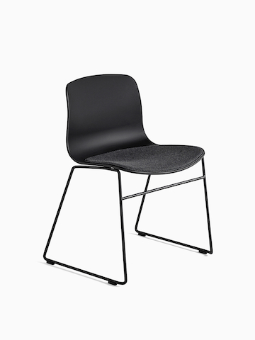Black About A Chair with sled base, viewed at an angle. Select to go to the About A Chair product page.