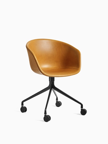 Leather upholstered, 4-star black swivel base About A Chair, viewed at an angle.