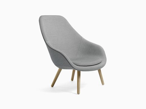 Gray About A Lounge Chair with wooden base, viewed at an angle.