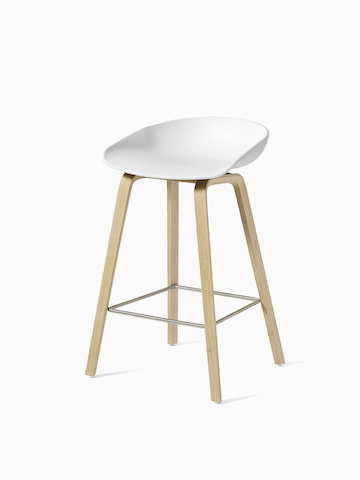 White About A Stool with wooden base, viewed at an angle. Select to go to the About A Stool product page. 