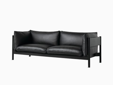 A front angle view of a black leather Arbour Sofa.