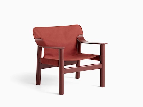 A front angle view of the Bernard Lounge Chair with a red frame, seat and back.