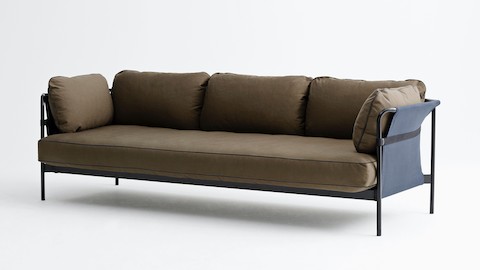 A 3-seat Can Sofa from HAY in dark brown fabric upholstery and a black frame with a blue sling, viewed from the front at a slight angle.