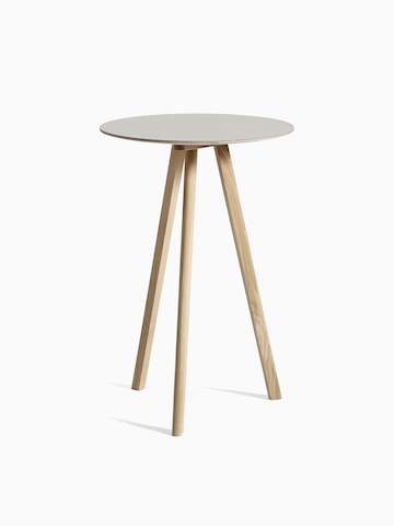 gray Copenhague Bistro Table with wooden legs, viewed at an angle.