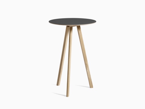 Black Copenhague Bistro Table with wooden legs, viewed at an angle.