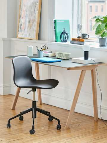 A Copenhague Desk with an About A Chair in black.