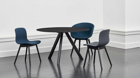 Side view of the Copenhague Table–Round in black.