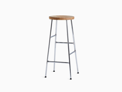 A front angle view of the Cornet Barstool with oak seat and chrome leg base. A front angle view of the Cornet Barstool with oak seat and chrome leg base.